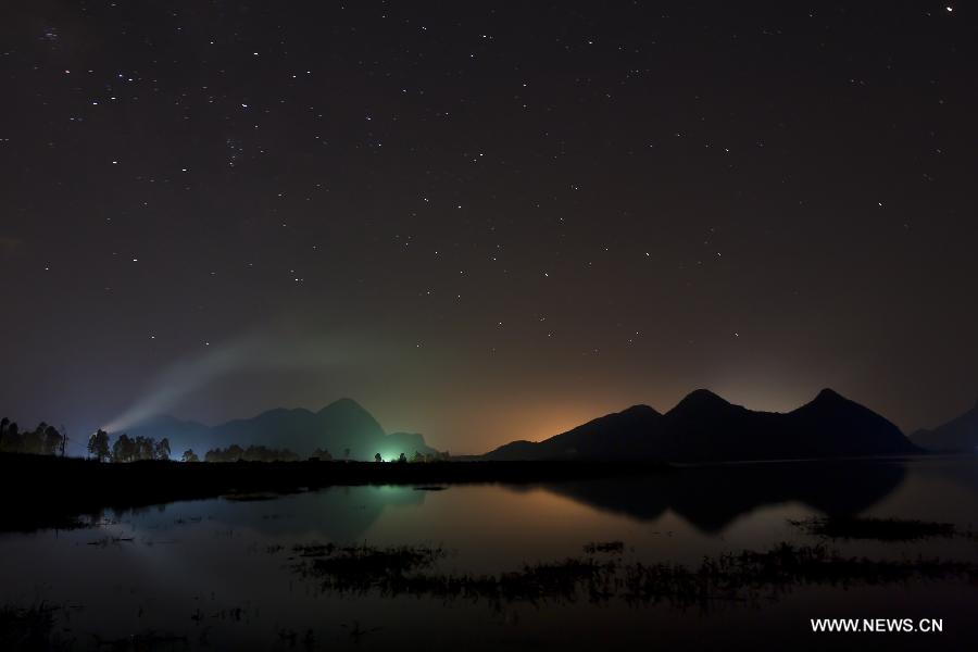 Stars are seen in the sky above Liucheng County in Liuzhou City, south China's Guangxi Zhuang Autonomous Region, July 21, 2014.